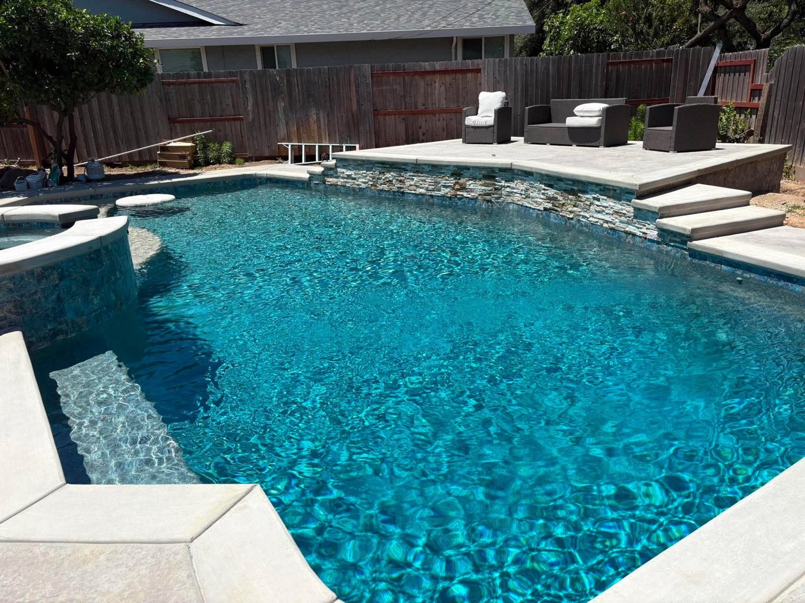 Geometric pool with a spillover spa