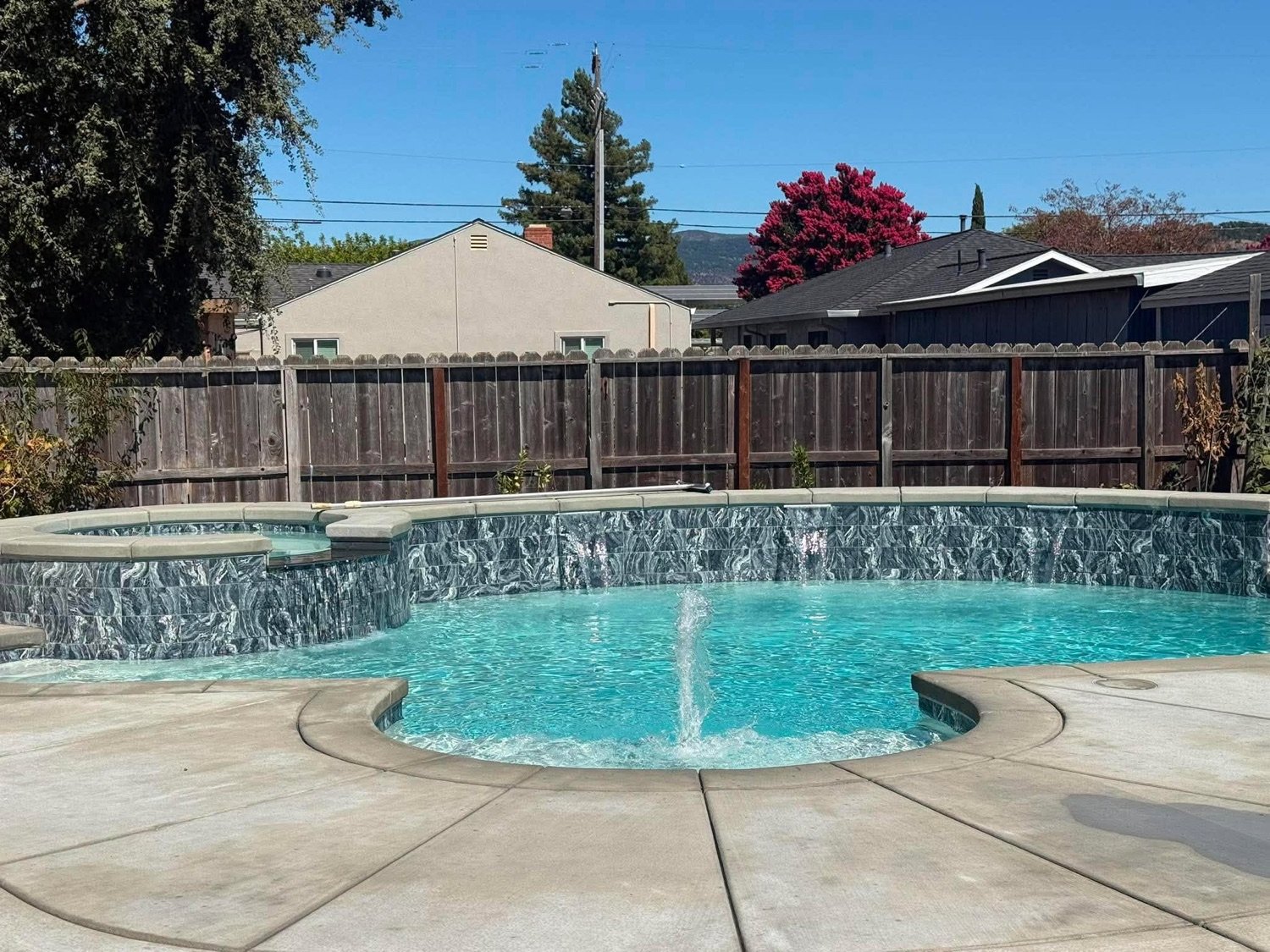 Custom pool with a sheer-descent water feature